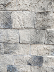 Stone wall texture close up light gray masonry vertical