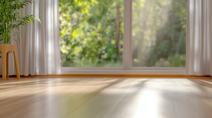 Bright and airy living space with wooden flooring and large windows letting in natural light and greenery.