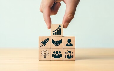 Building a Successful Business with Wooden Blocks representing growth and teamwork concept.