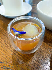 Artistic Cocktail in Glass with Floral Garnish