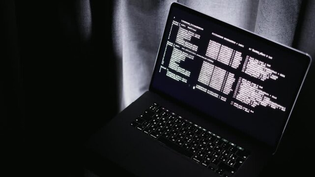 Administrator checks system logs quietly, Control room with subdued lighting and monitoring system performance, Quiet environment where system administrator reviews server logs and grid data actively