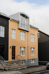A striking yellow building featuring modern architecture and quaint charm.