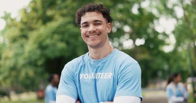 Face, volunteer and happy man in park with arms crossed for eco project, outreach or NGO service. Confident, person outdoor or charity work for climate change program, social responsibility or bokeh.