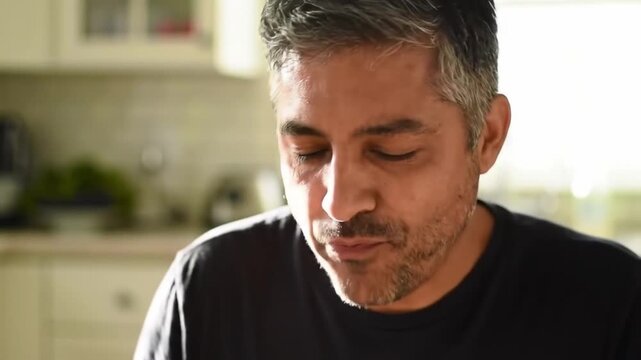 A man enjoying a healthy salad for lunch focusing on nutritious eating habits and a balanced diet.