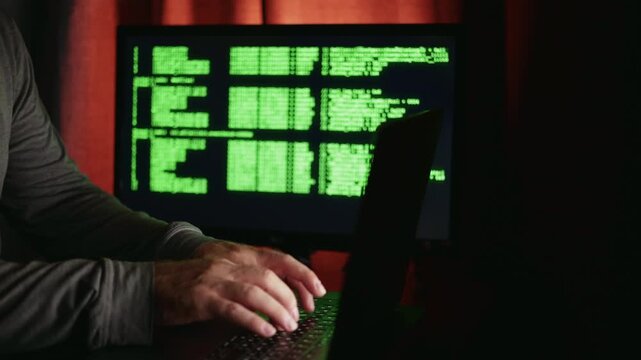 Hands near glowing computer screen, Intense concentration amid vibrant tech workspace setting, People intensely working on programming tasks against colorful backdrop with focused expressions