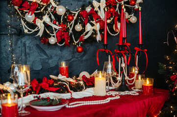 a table with Christmas decorations and candles