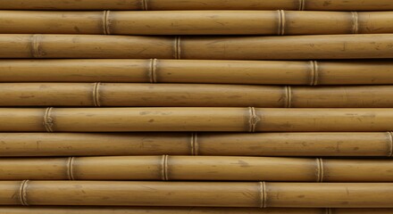 Fototapeta premium Closeup of horizontal yellowishbrown bamboo stalks stacked in parallel rows showcasing natural nodes and textures