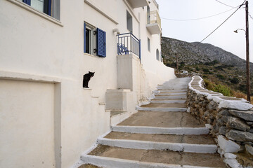 Stairs in Potamos leading to a viewpoint over the Aegean Sea. Amorgos, Cyclades, Greece