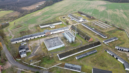 An aerial view capturing the agricultural landscape with farm buildings and cultivated fields.