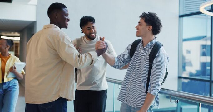 Men, handshake and happy with friends at campus with greeting, hug and talk with reunion at college. People, shaking hands and students with smile, conversation or excited for education at university