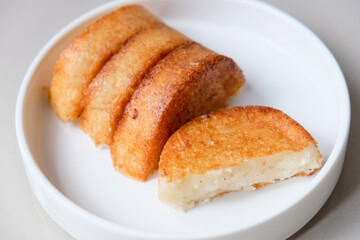 Kue pancong, gandos or bandros is an Indonesian traditional snack made from a mixture of rice flour, grated coconut, and coconut milk