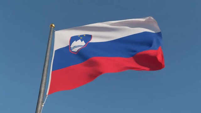 Slovenian flag waving proudly against a clear blue sky, symbolizing national pride and identity in a dynamic outdoor scene for patriotic celebrations - Powered by Adobe