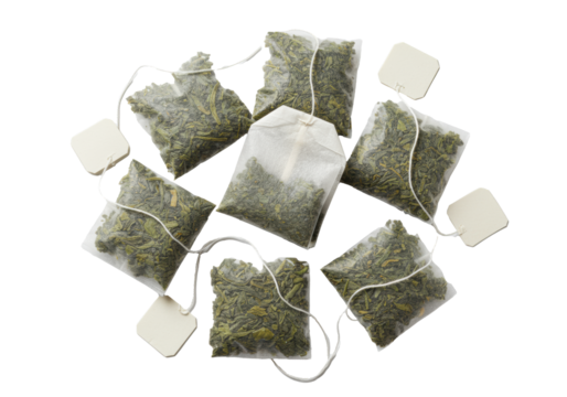 geometrically arranged square paper tea bags showing premium emerald green loose-leaf tea texture, isolated on transparent background, sharp flat lay, concept for premium product advertising