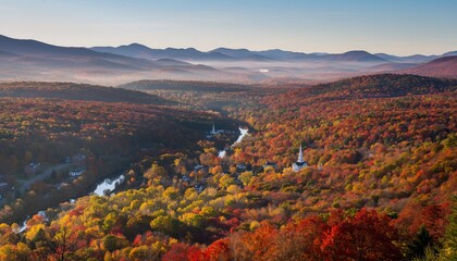 Fototapeta premium Autumn Vista: a panorama of a valley ablaze with the warm hues of autumn, from vibrant reds and oranges to gentle yellows and greens.