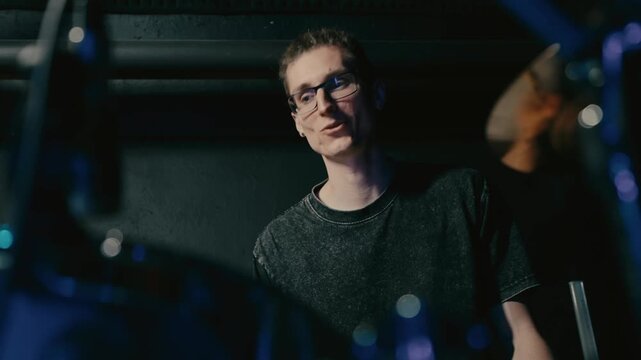 Closeup of drummer capturing precise movements and joyful
