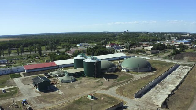 Aerial view of biogas plant showcasing digesters and gas holders in action