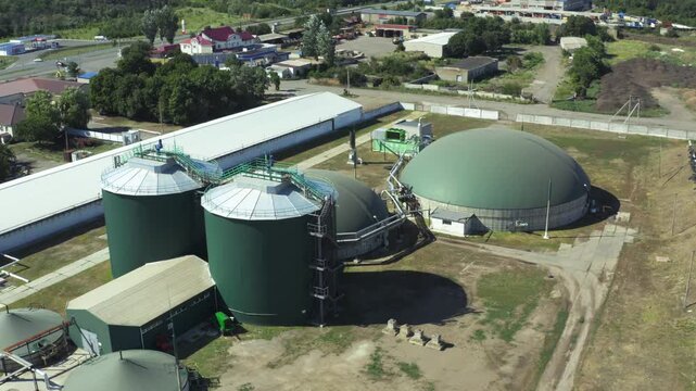 Aerial view of a biogas plant with digesters and gas holders in operation
