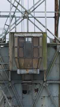 historic boelwerf crane operator cabin temse belgium scene riverside apartments scheldt river background backward aerial drone shot view 