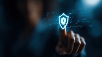 Internet security: Person's finger touches a glowing digital shield icon for online data privacy and protection.