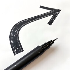 Black marker pen drawing a curved arrow on a white background