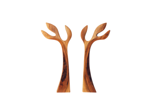 Two wooden trees are standing next to each other
