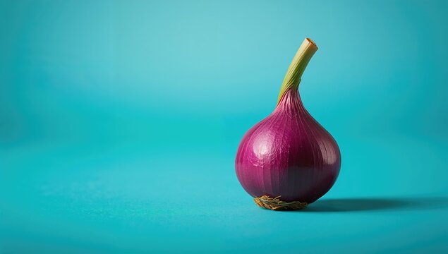 Purple onion with a green stem on a turquoise backdrop, fiber-dense choice