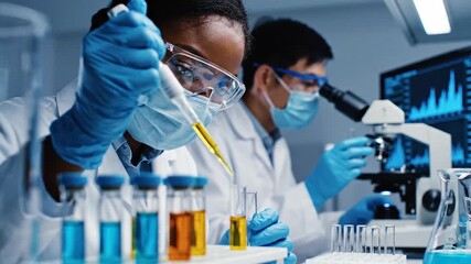 Diverse scientists conducting complex chemical research in a modern lab - Powered by Adobe