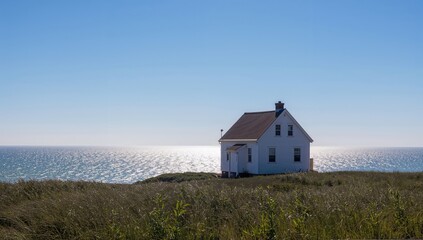 A white house on a sunny summer day by the beach, showcasing architectural beauty, seasonal change