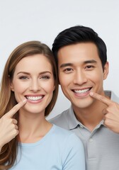 Happy multiethnic couple proudly showcasing their radiant, healthy white teeth with confident smiles, highlighting the benefits of excellent dental care and oral hygiene