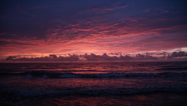 Sunrise over ocean waves, dramatic cloud patterns reflecting light, seasonal change
