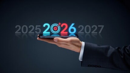 Hand holding a smartphone displaying the year 2026, signifying future technology and planning
