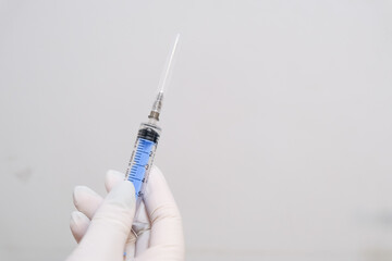 A medical syringe with a needle placed on an isolated background. Concept A sterile injection tool presented for healthcare-related use.