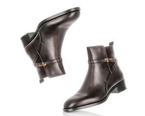 Leather women's demi-season boots isolated on white background, close-up