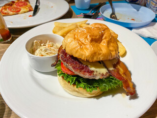 Delicious Gourmet Burger with Bacon and Fries
