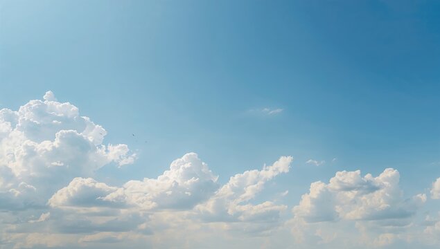 Fluffy white clouds drifting in a blue sky, ideal for a serene background