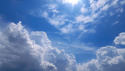 White fluffy clouds against a bright blue sky, ideal for a serene backdrop