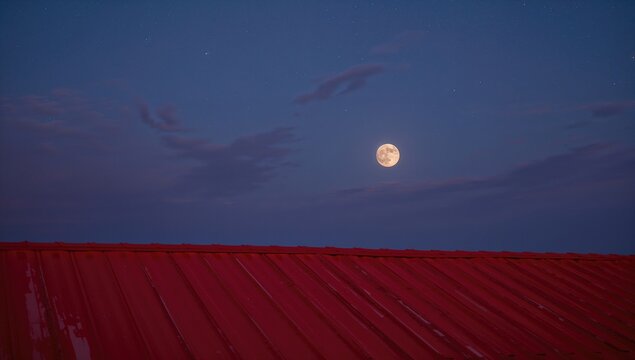 Red rooftop under a night sky, observing seasonal change - Powered by Adobe