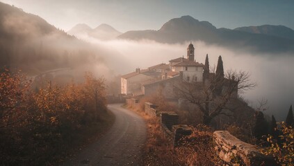 Sea fog envelops an autumn landscape with mountains and a village, highlighting seasonal change