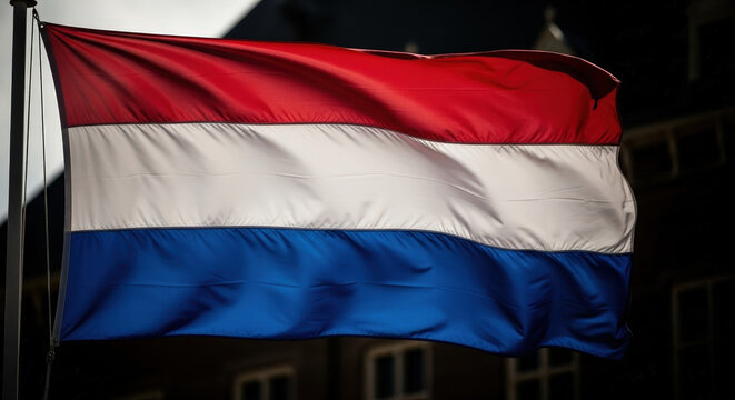 Vibrant Dutch Flag Proudly Waving in the Wind Against a Dark Background
