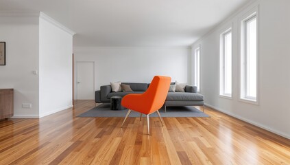 Naklejka premium A living room featuring white walls and wooden flooring, with an orange chair positioned before the couch, showcasing a focus on vibrant color contrast.