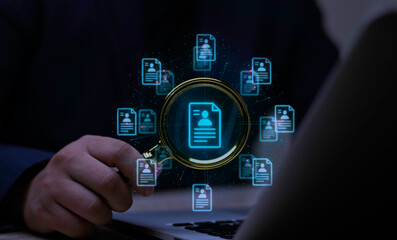 Businessman uses AI for recruitment and HR technology, analyzing candidate profiles on a virtual hologram for talent acquisition.