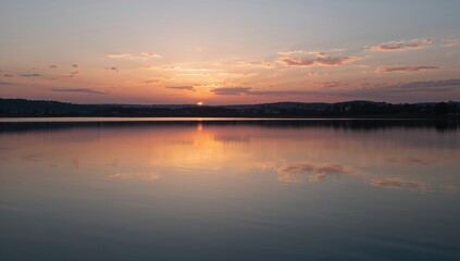 Naklejka premium Sunrise Above Tranquil Waters, seasonal change