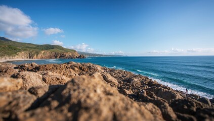 Rocky coastal beach landscape with sea and rock formations, erosion risk