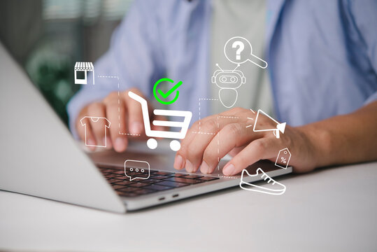 Man hands using laptop online shopping. E-commerce technology virtual interface cart icon checkmark. Customer buying product digital store. Retail marketing payment chatbot support concept.