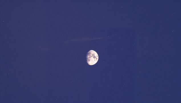 The full moon seen through a telescope from the northern hemisphere, standing alone against a white background