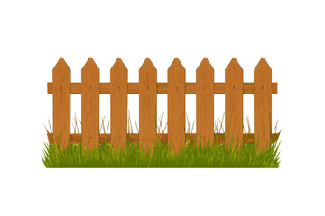 Fototapeta premium Segment of classic wooden picket fence standing in vibrant green grass isolated