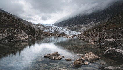 Remnants of a melting glacier in Slims River valley, showcasing erosion risk from mountain creek flow