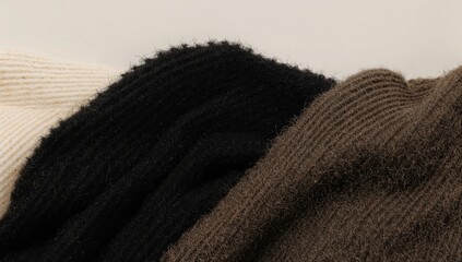 Fototapeta premium Warm knitted wool texture, ideal for winter apparel, seasonal change