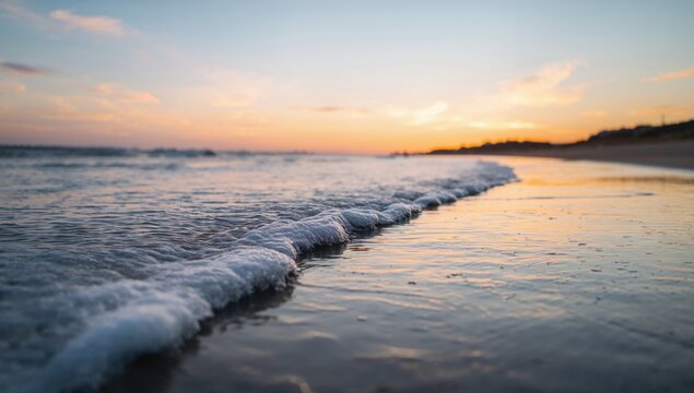 Waves in motion during a golden hour sunrise over the ocean, evoking tranquility and natural beauty