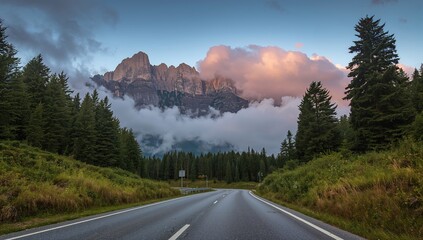 Alpine highway winding through mountains at sunset, showcasing seasonal change